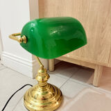 Gold and green banker’s desk lamp.