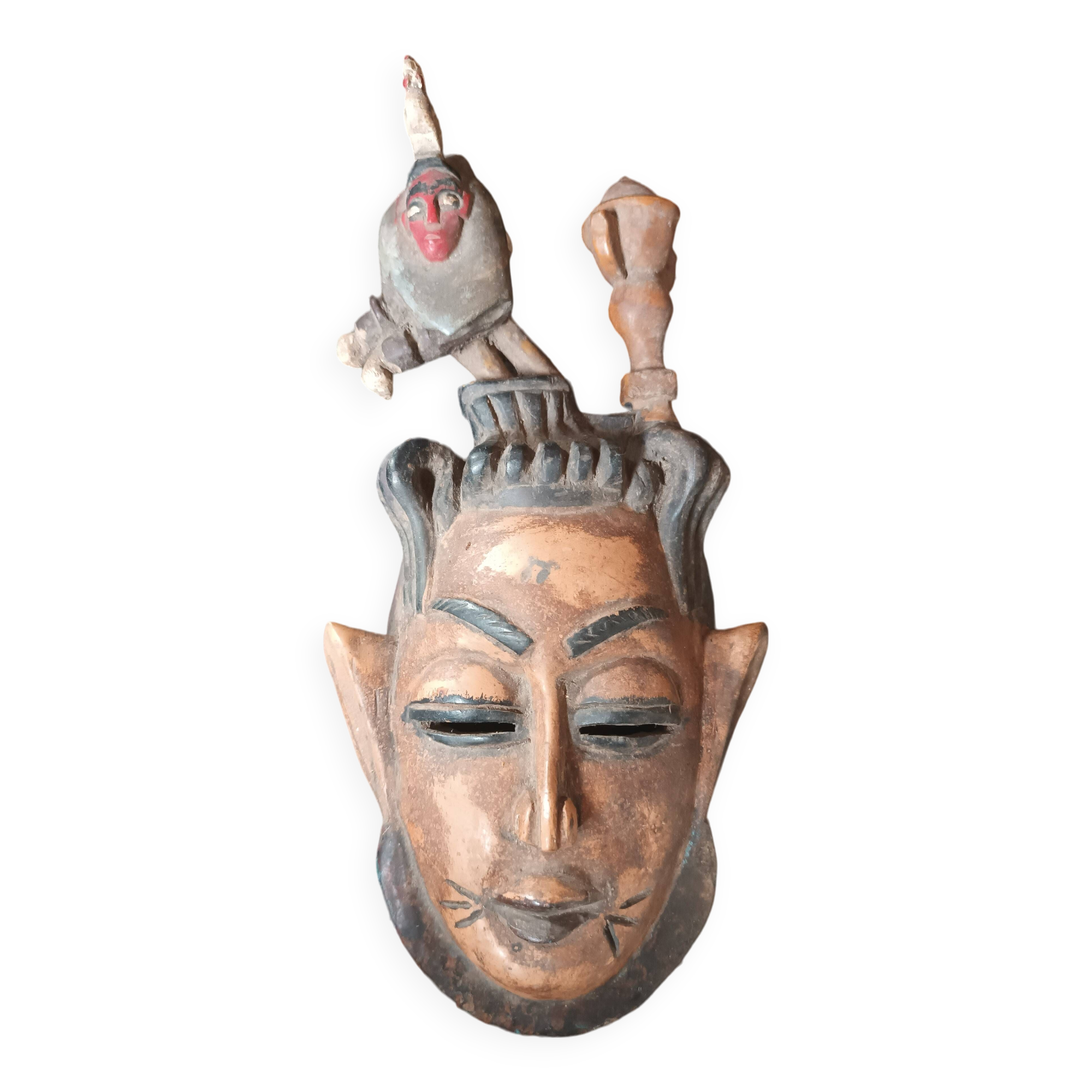 Old tribal ethnic mask in carved wood