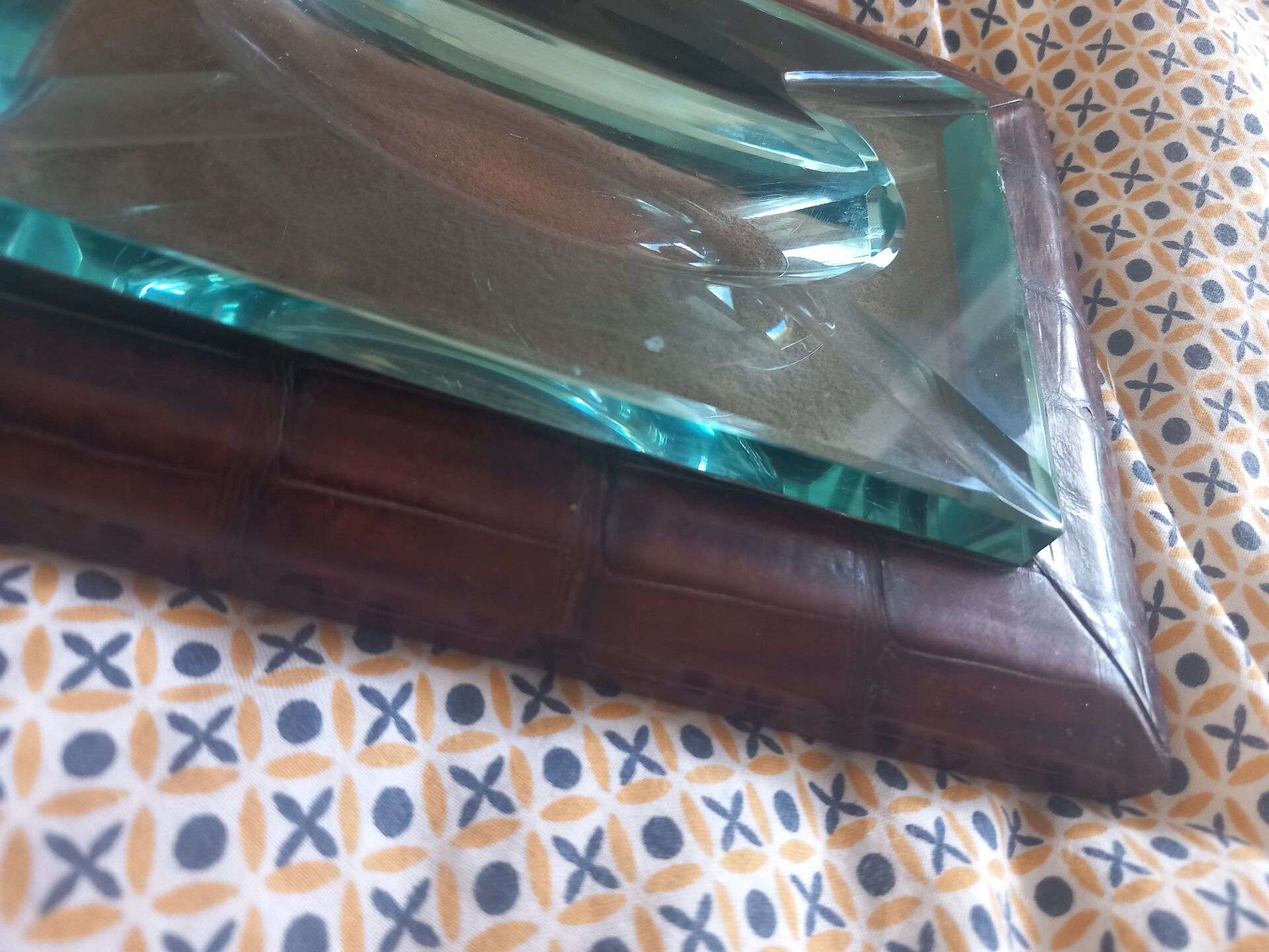 Crocodile leather ashtray with cut crystal.