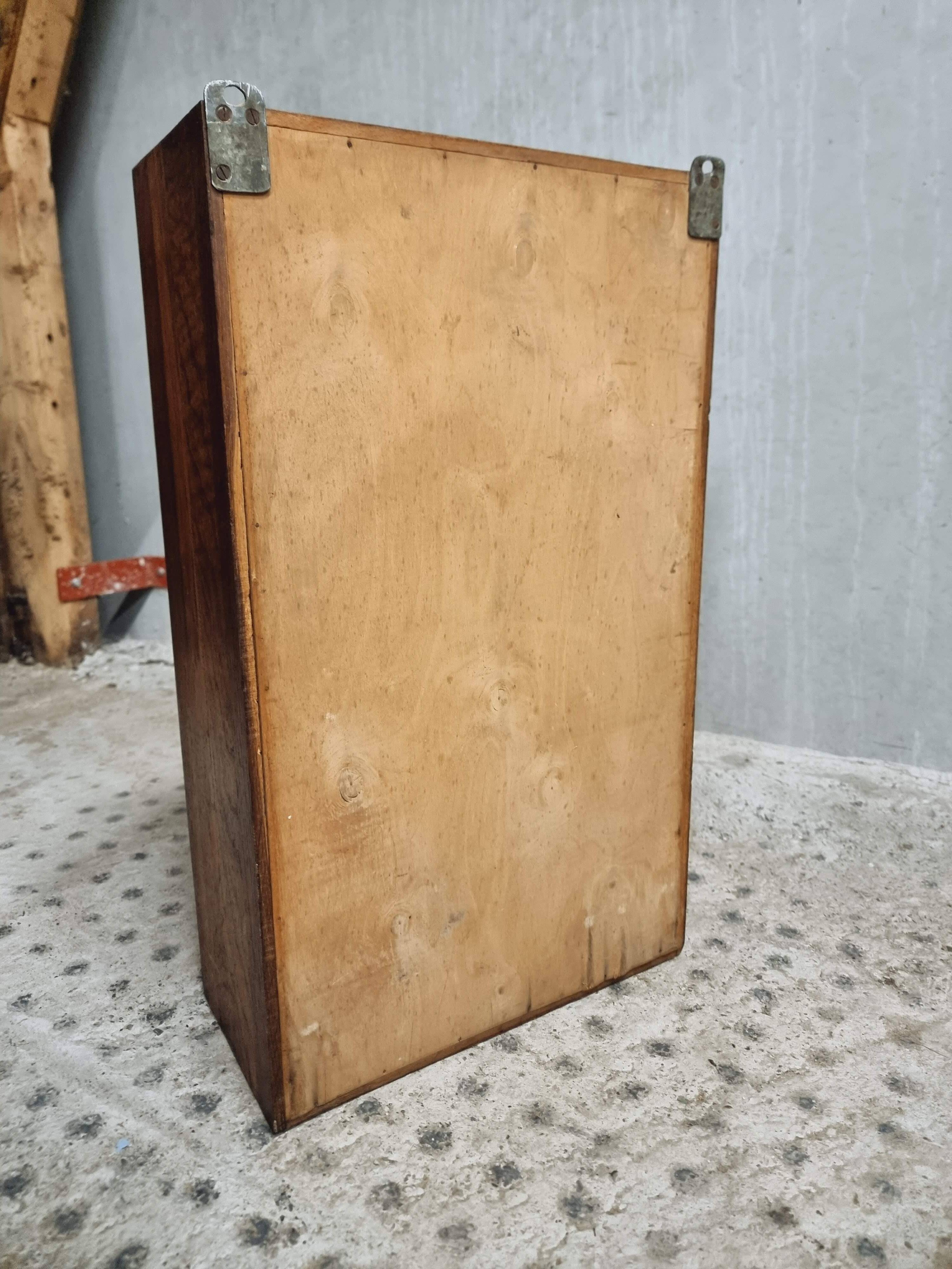 Old hanging cupboard medicine cabinet with mirror and drawer
