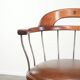 Set of 2 swivel/office chairs with a cognac-coloured cow leather seat