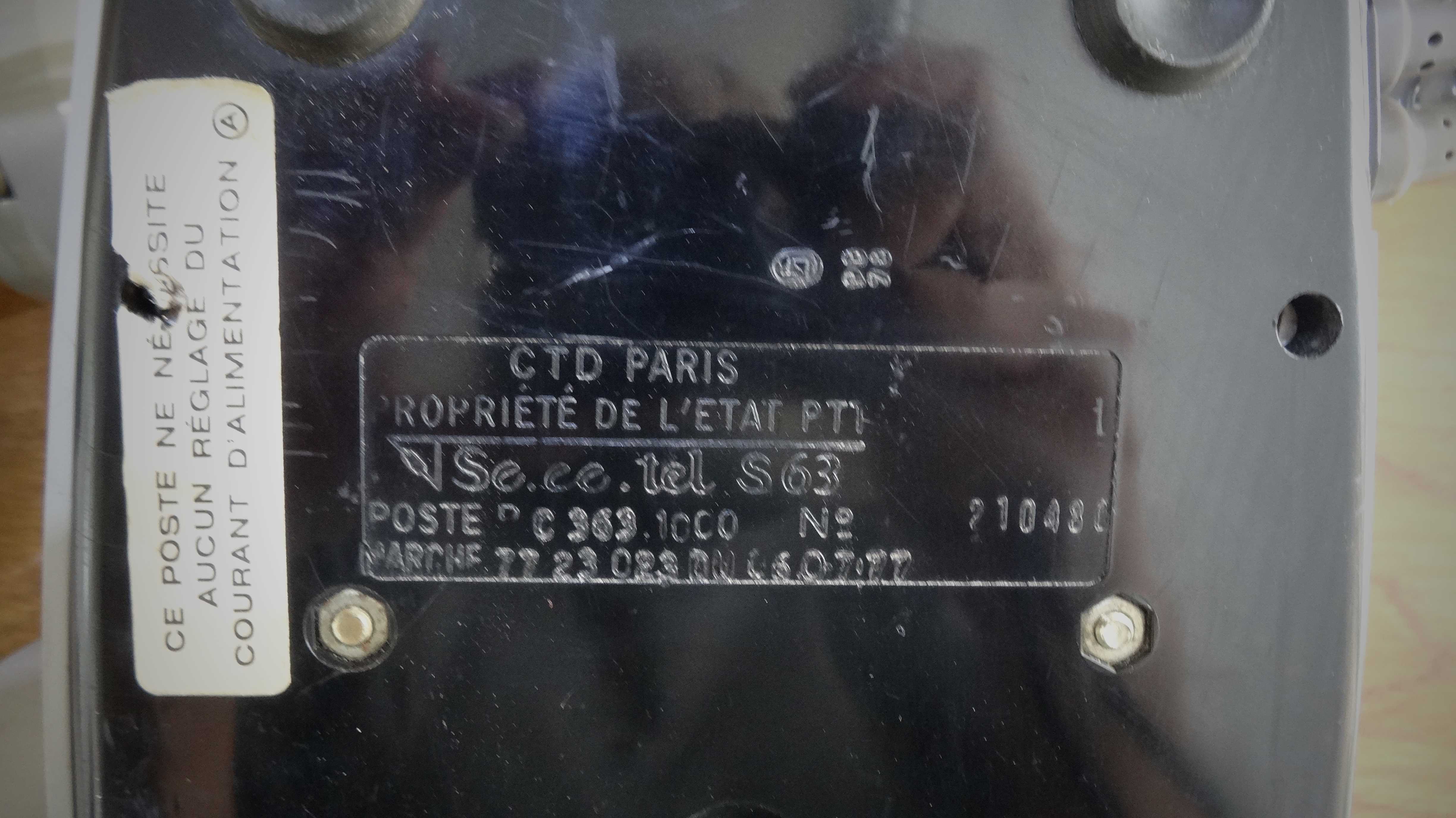 Grey vintage rotary dial phone with earpiece