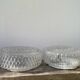 Pair of transparent round glass wall lights