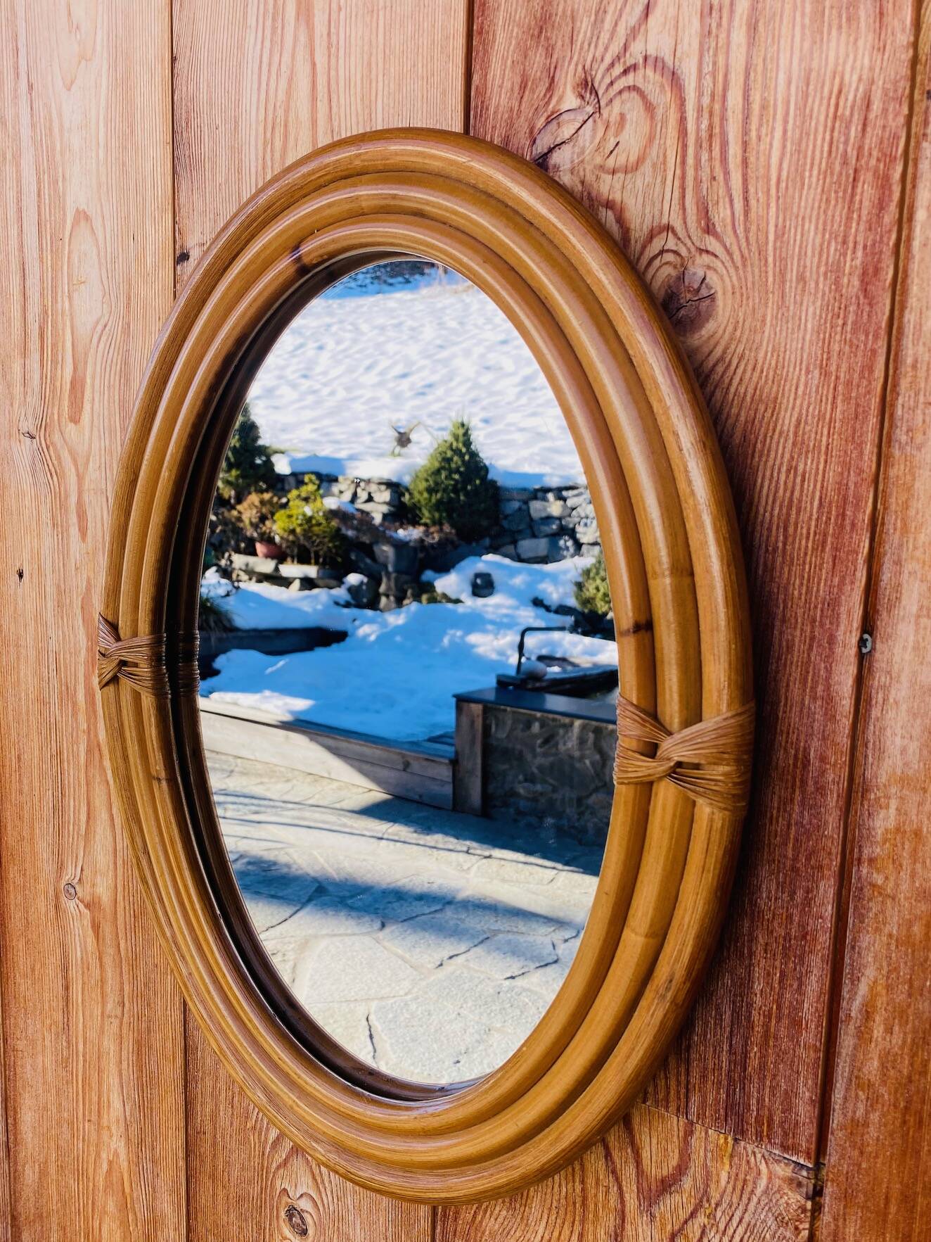 Vintage oval rattan mirror