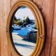 Vintage oval rattan mirror