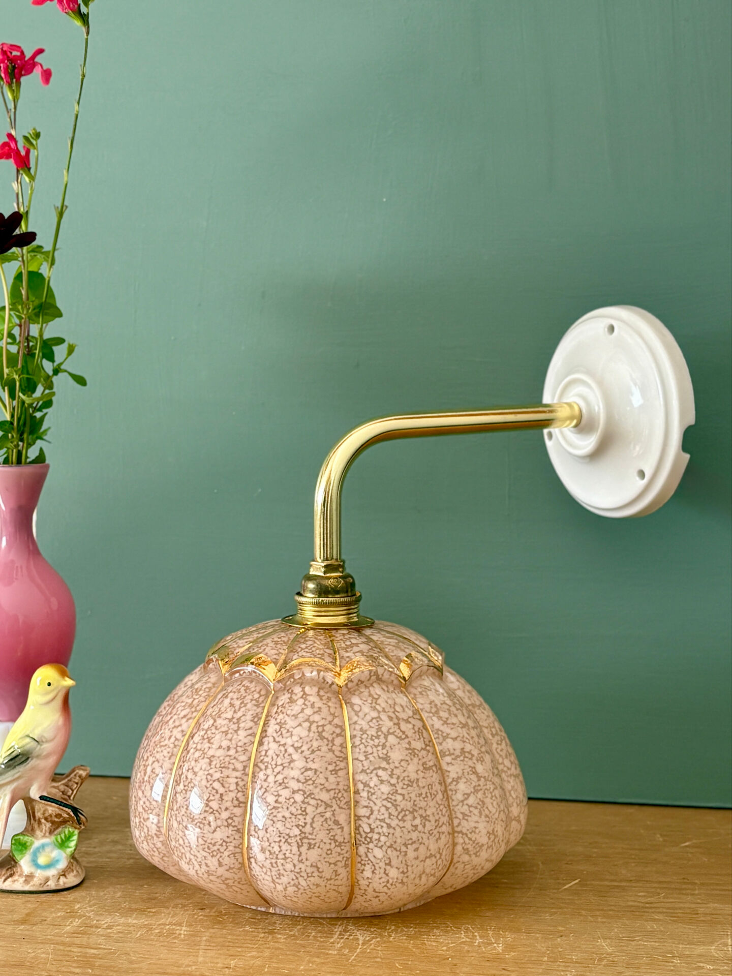 Vintage glass wall light with a pink and gold Clichy globe.