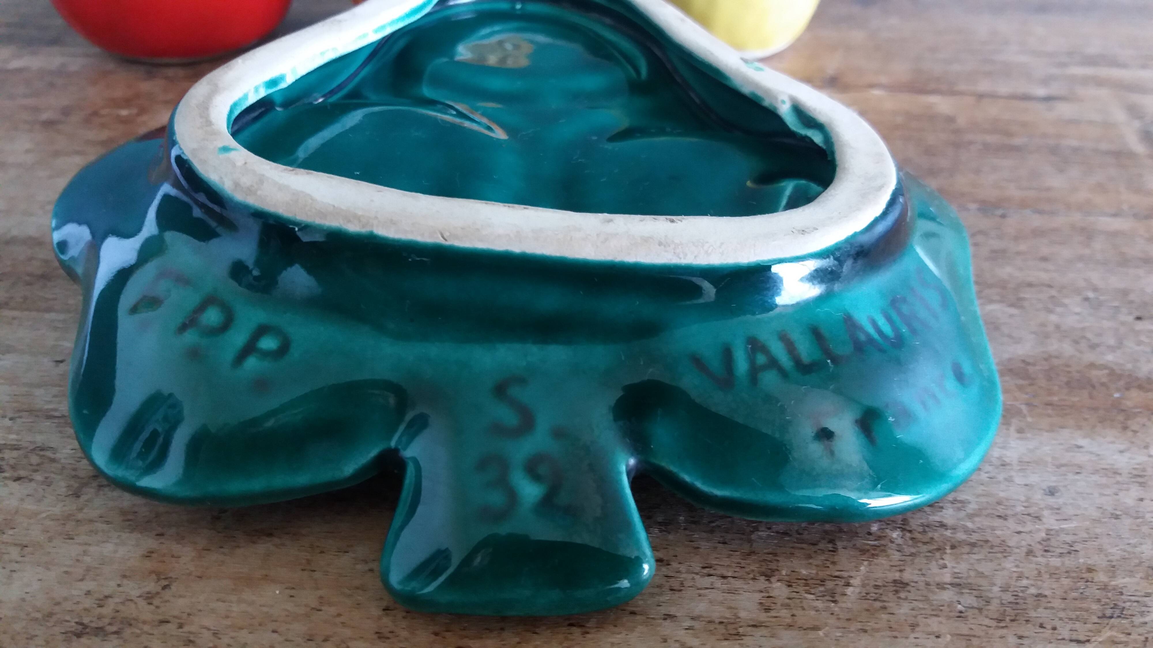 Salt and pepper shaker vegetables on a slipware leaf signed FPP Vallauris.