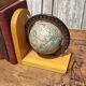 Pair of greenhouses vintage wooden books world map