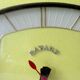 Pendule, Bayard wall clock in yellow formica from the 60s