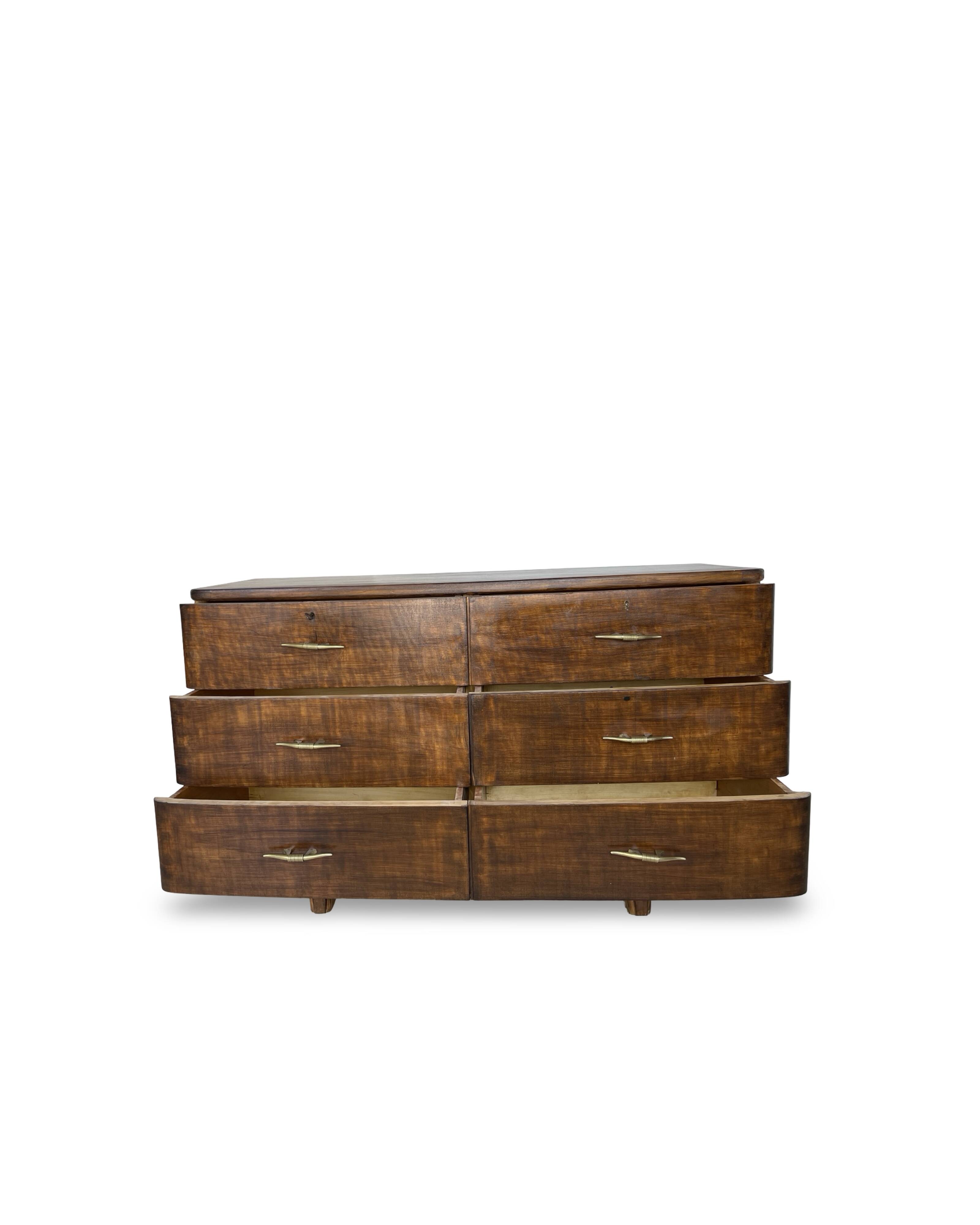 A vintage Italian chest of drawers, made of veneered walnut and solid wood,
