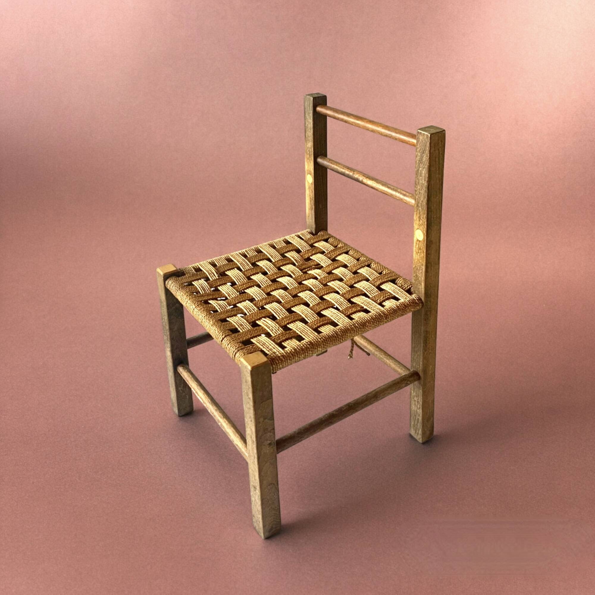 Vintage children's chair made of rope and wood