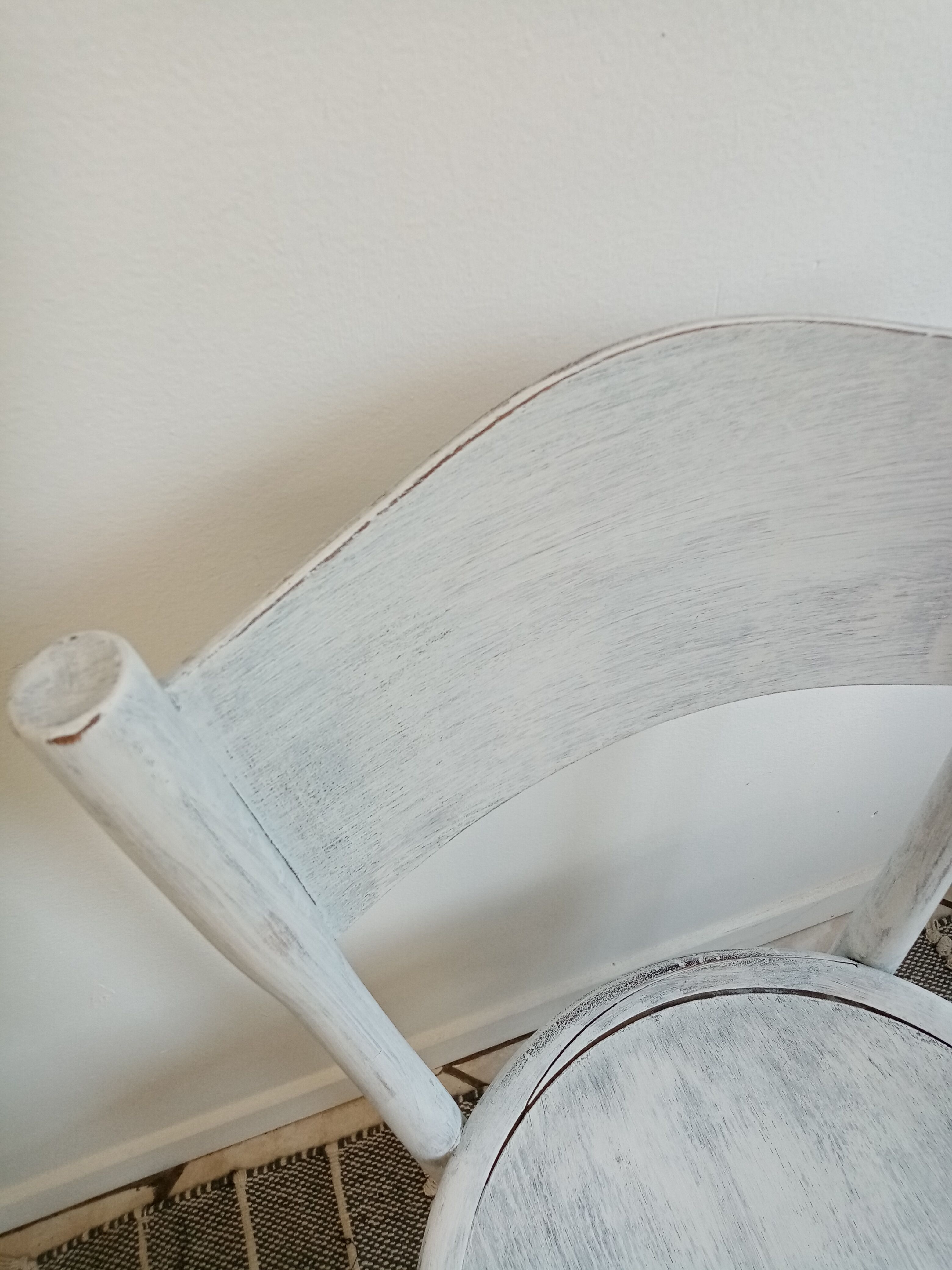 White antique children's chair in patinated wood