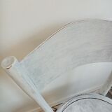 White antique children's chair in patinated wood