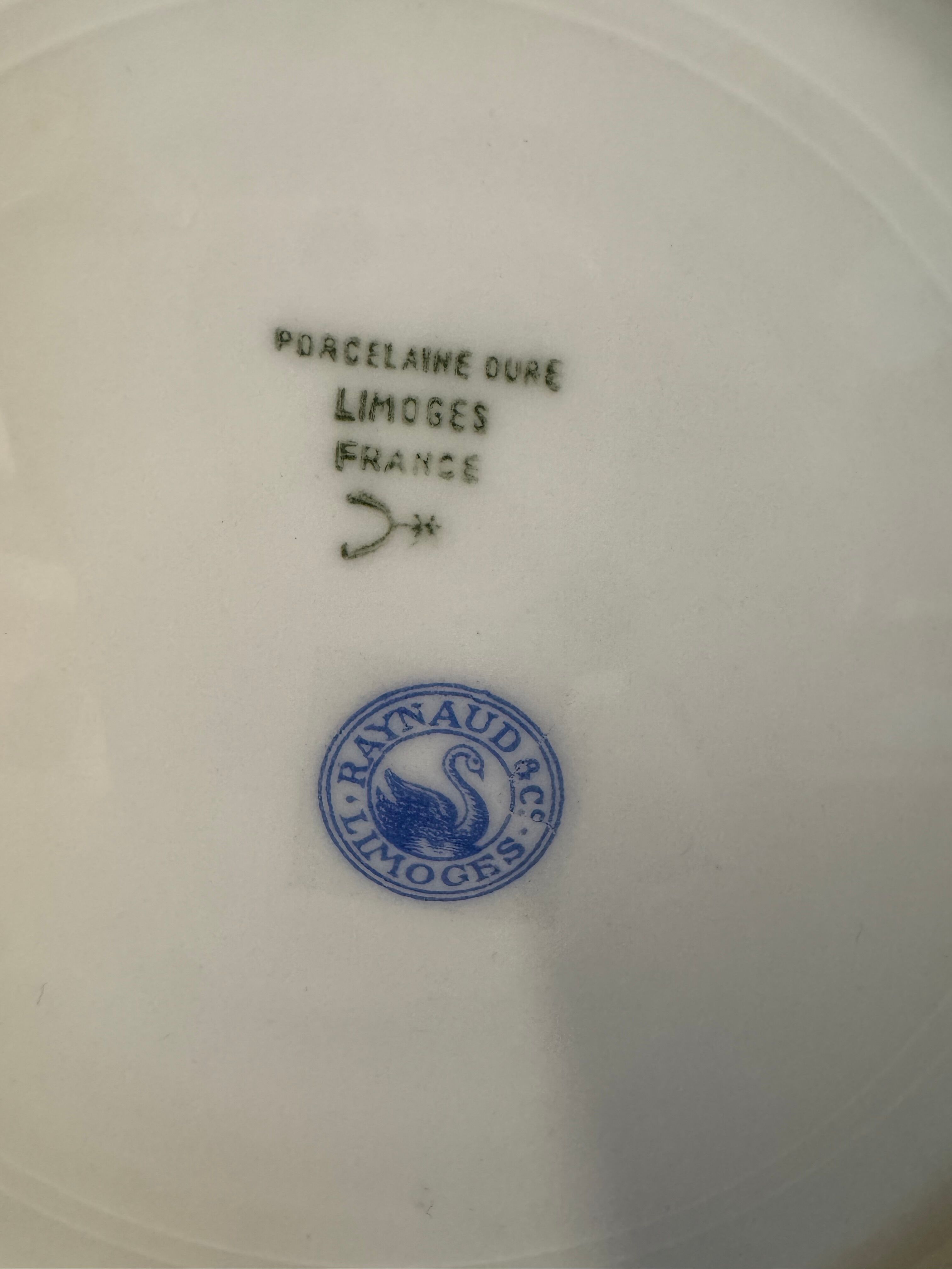Two Raynaud Limoges plates and Tetard brothers silver.