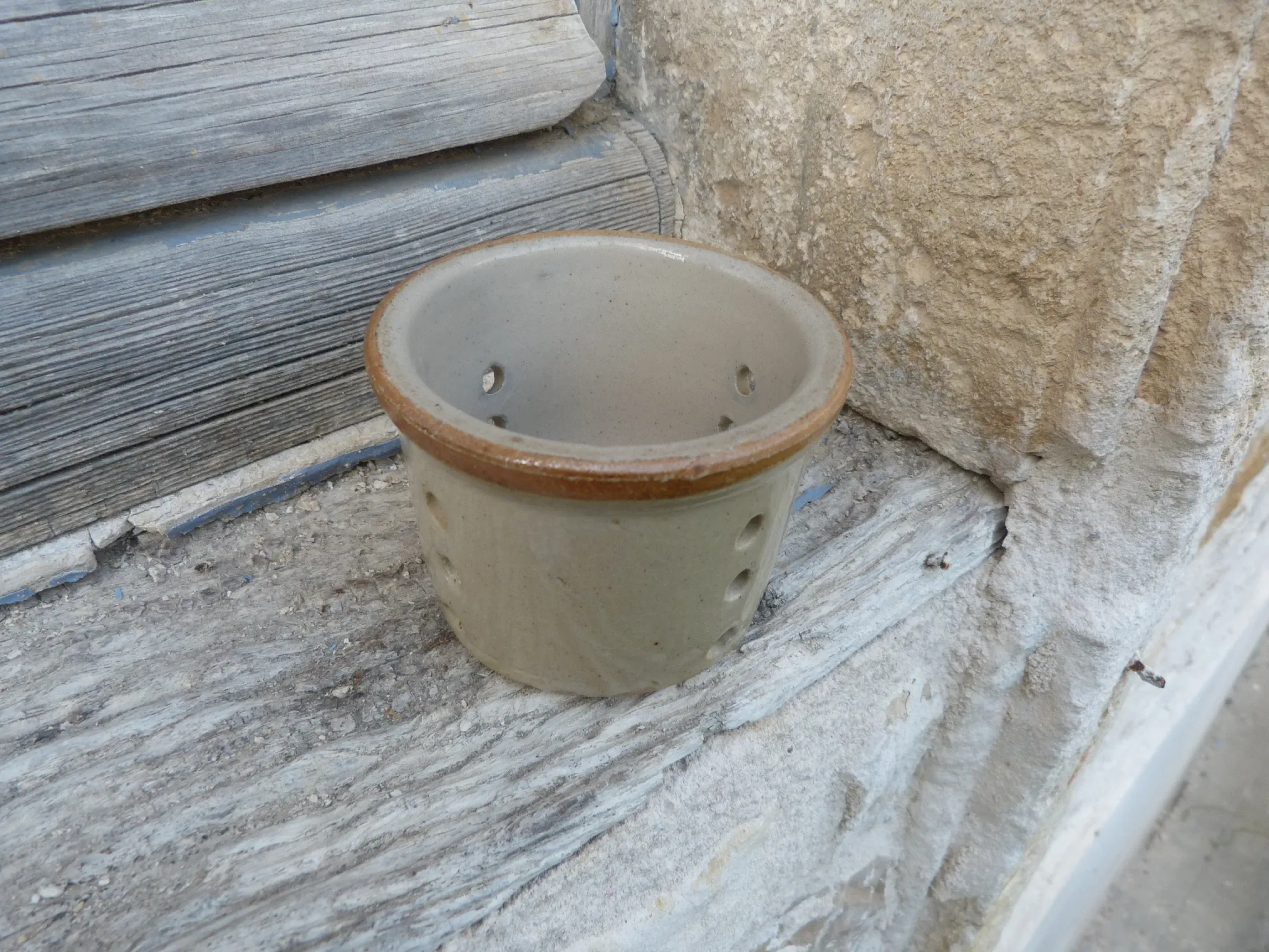 Vintage cheese draining pot in antique stoneware
