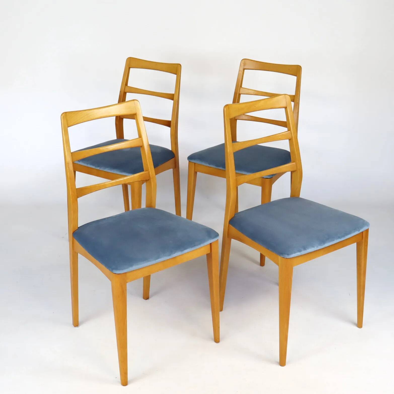 Set of four blue velvet Scandinavian chairs.