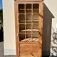 Raw wood display cabinet
