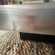 Coffee table – Black glass and brushed metal – 1970s