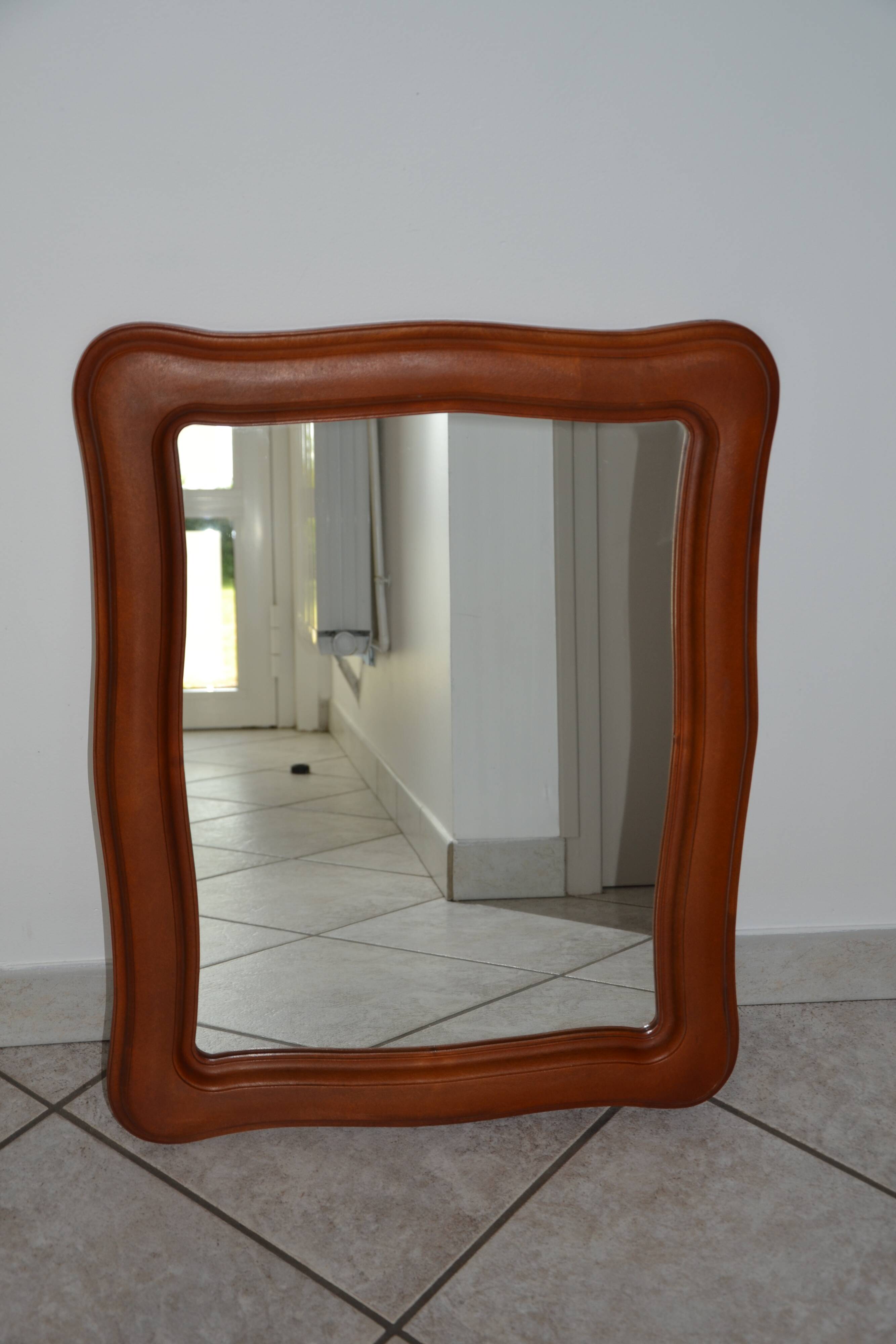 Vintage organic wavy cast resin mirror