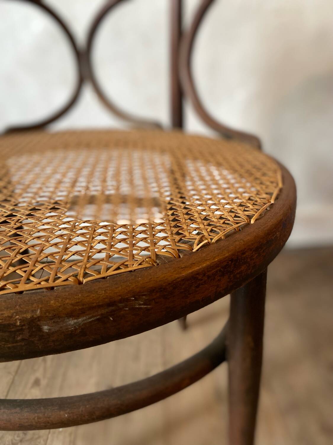 Cane and curved wood armchair