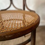Cane and curved wood armchair