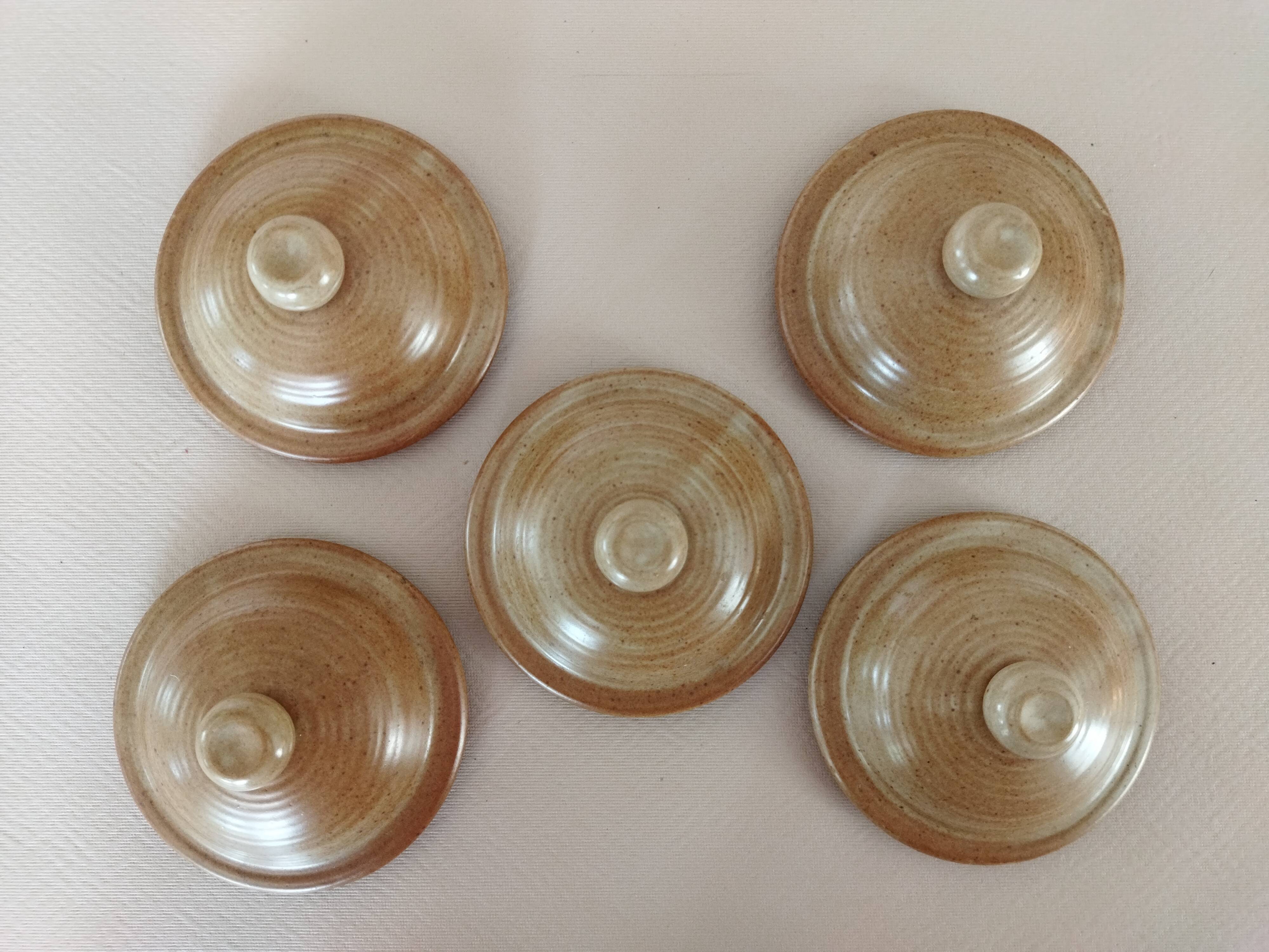 Covered tea bowls in CNP Village sandstone