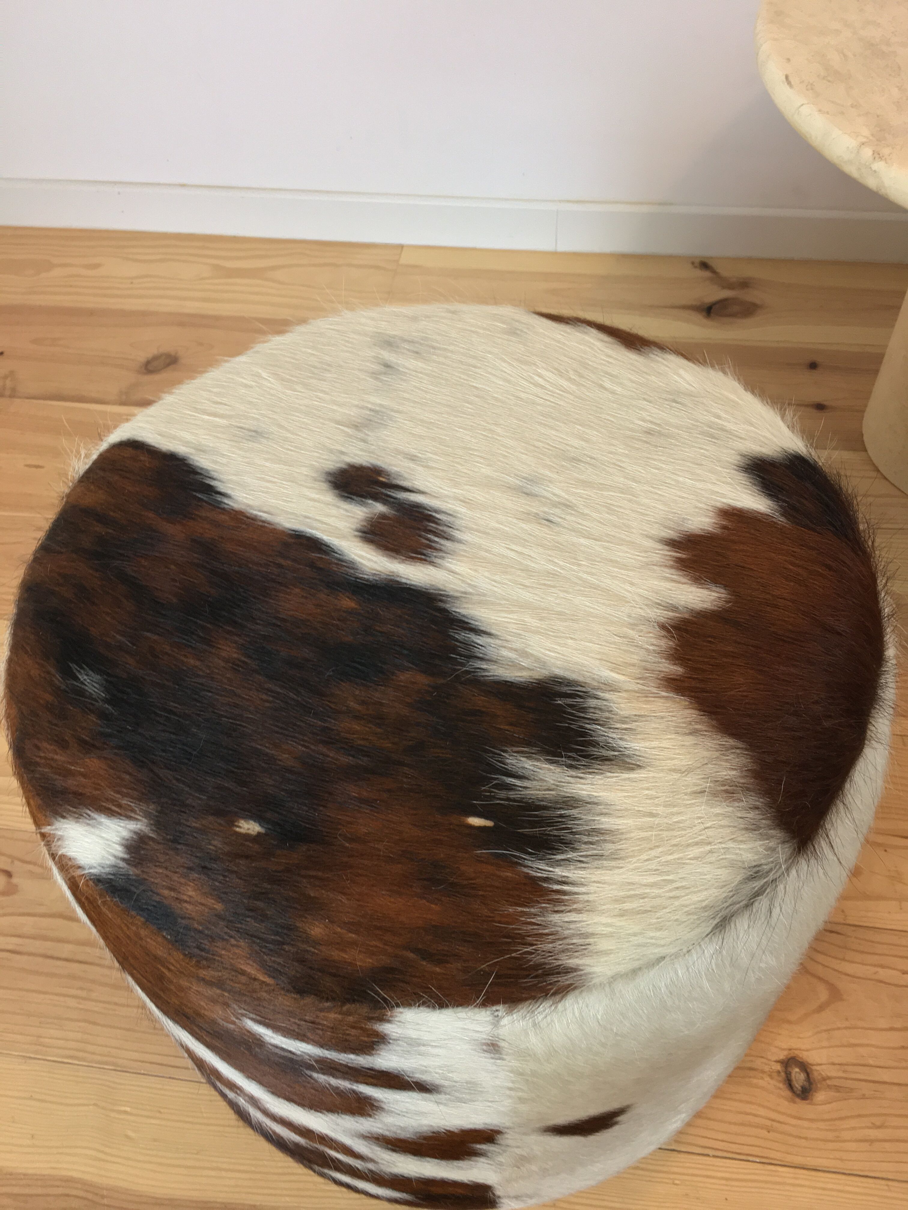 Pouf and cow cushion, leather