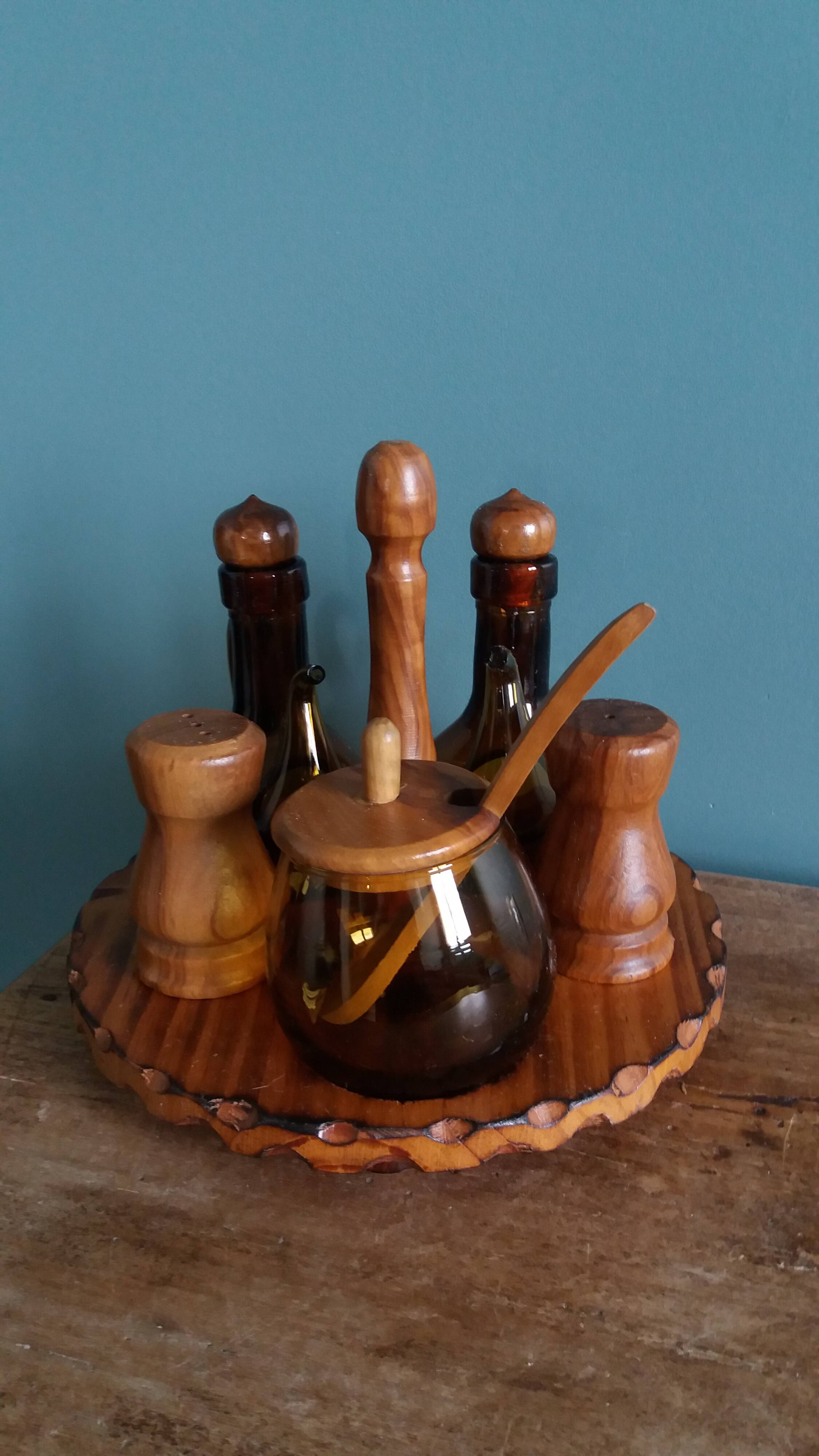 Oil, vinegar, mustard, pepper, salt, olive wood servant from Spain.