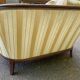 Two-seater Louis XVI canapé in golden beige fabric and curved solid wood.