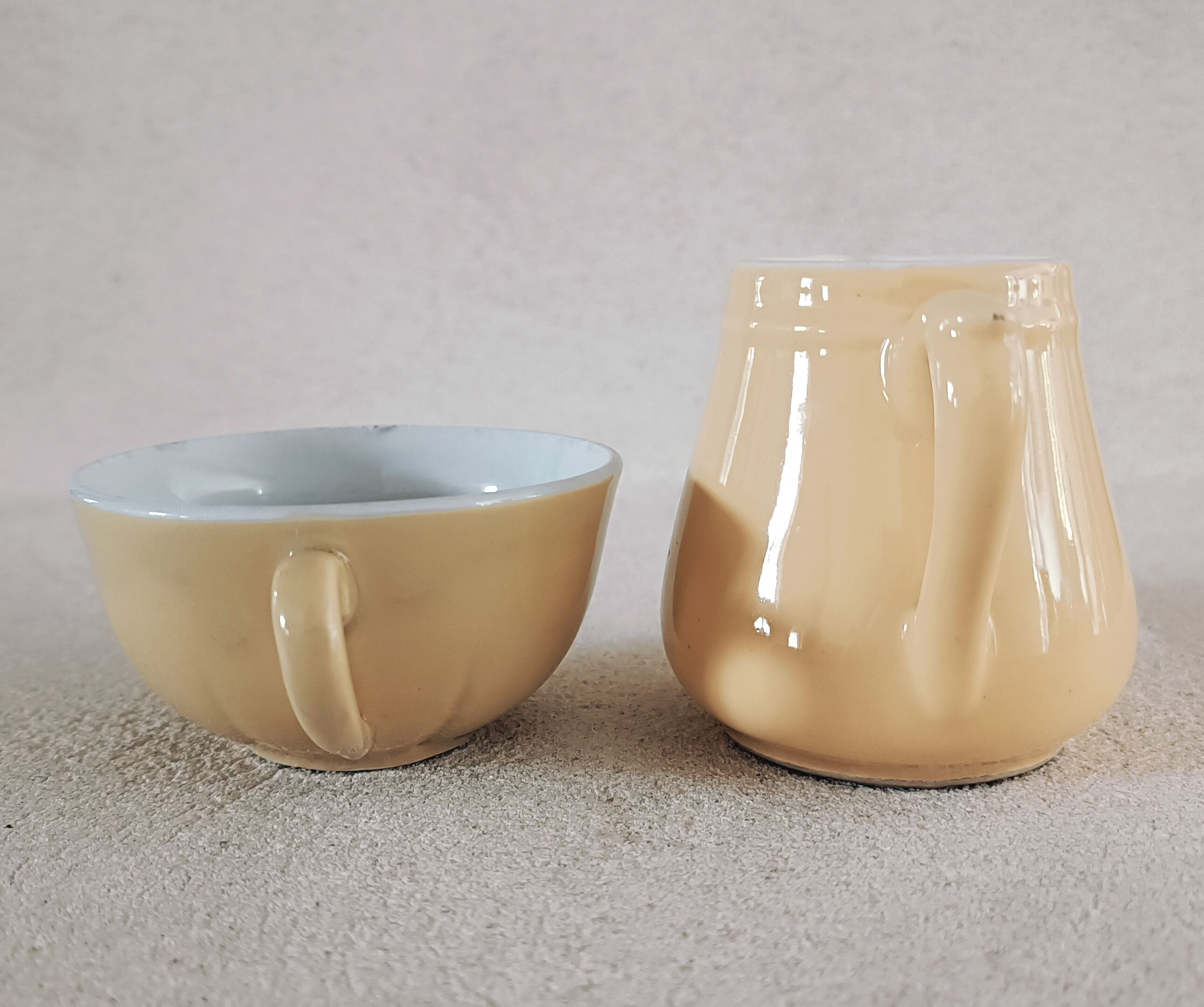 Earthenware cup and milk jar