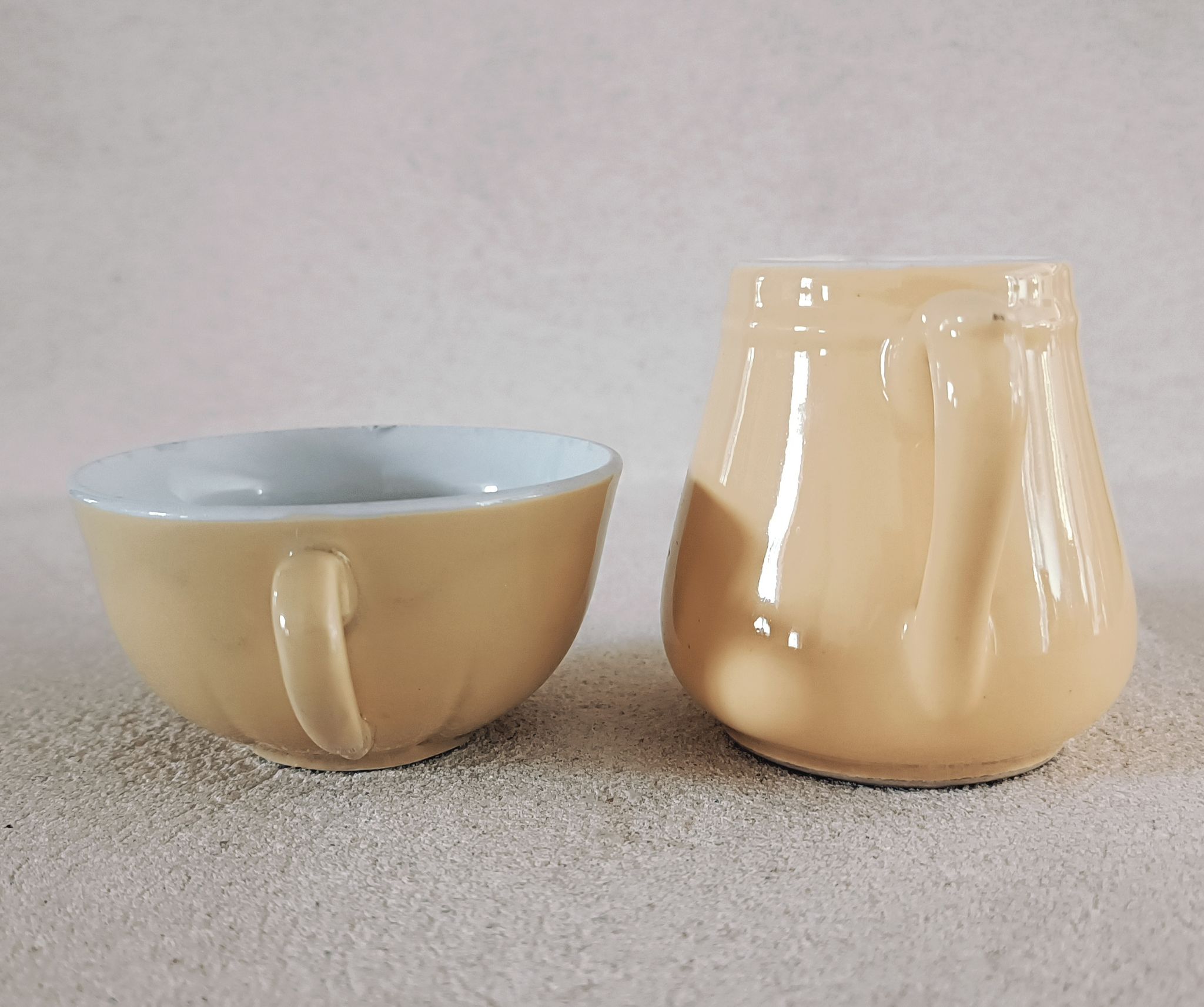Earthenware cup and milk jar