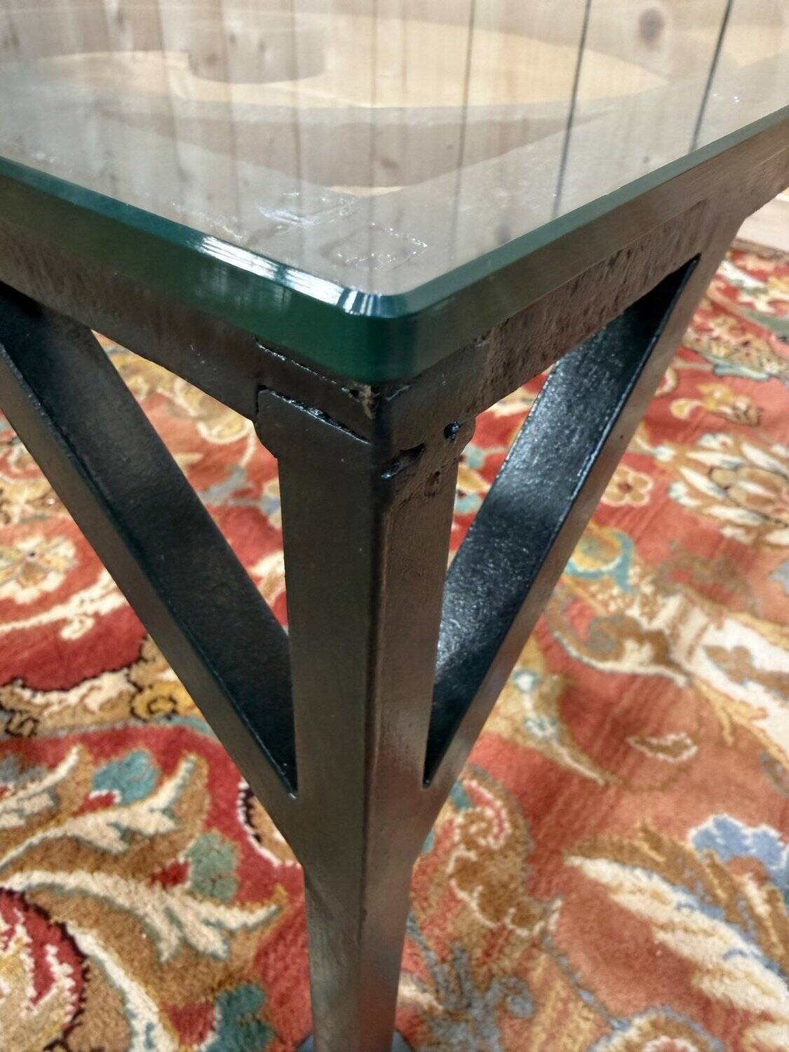 Wrought iron and glass coffee table from the 1900s.