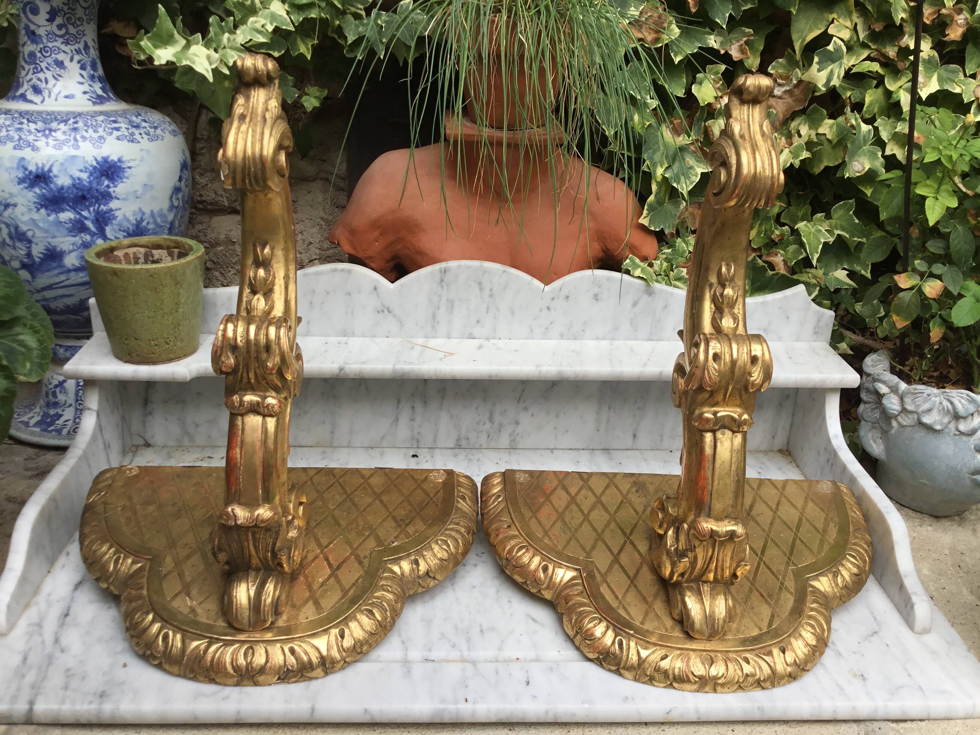 Important, pair of wooden consoles with gilded stucco in Louis XV style. XIX century.