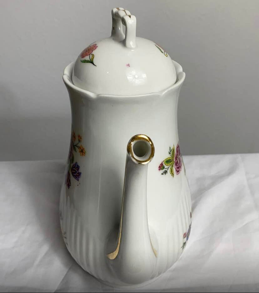 Antique porcelain teapot and sugar bowl