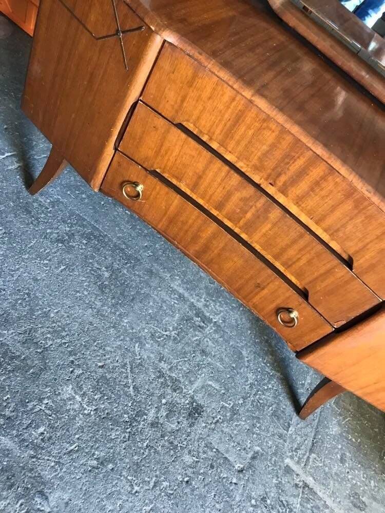 Vintage 1950s brown wooden dressing table with a double mirror and integrated storage.