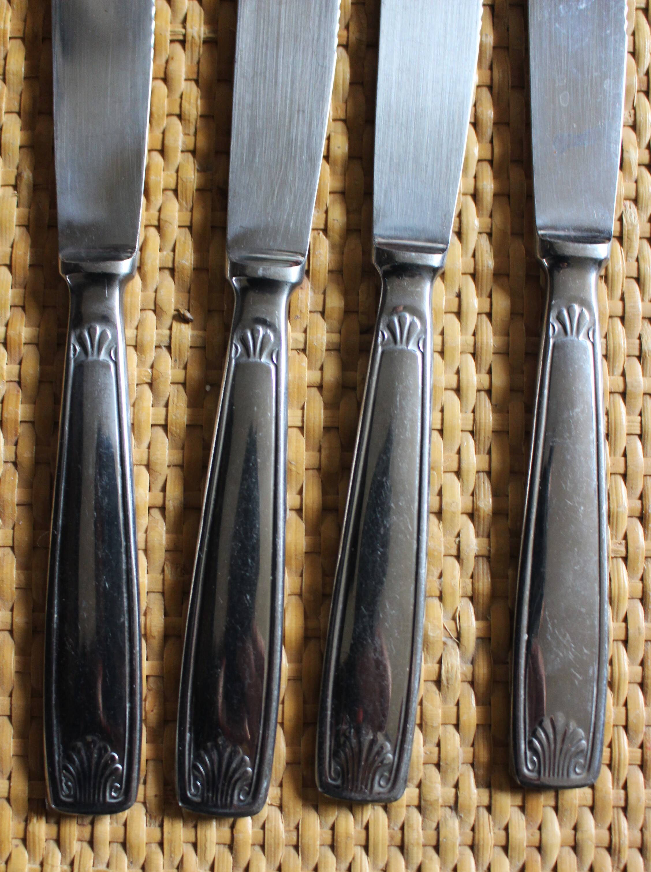 Mismatched set of 8 forks + 8 vintage shell stainless steel knives