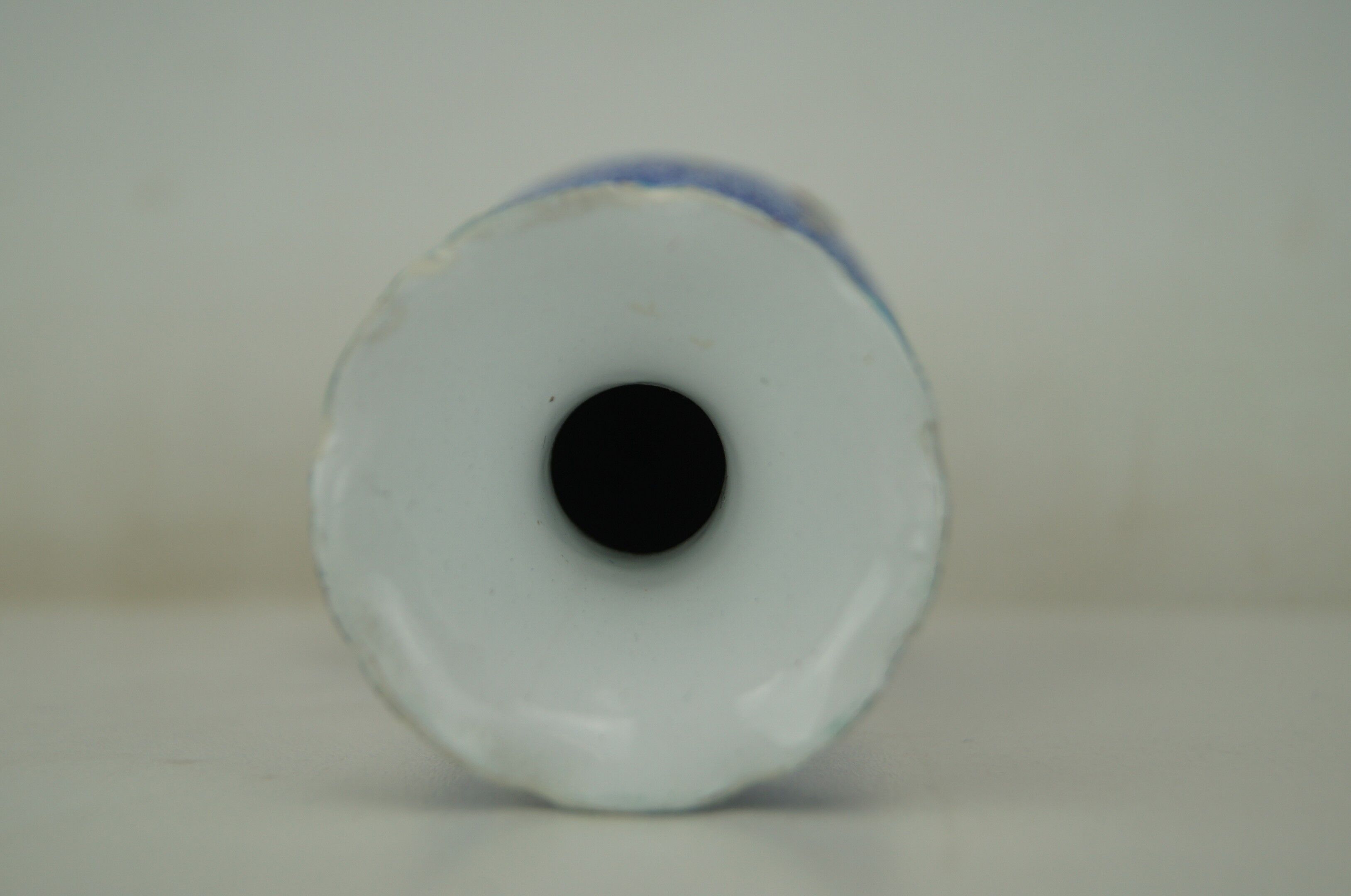 Piriform vase with a flared metal collar enamelled with a polychrome decoration, marked "Amini Iran" on the reverse.