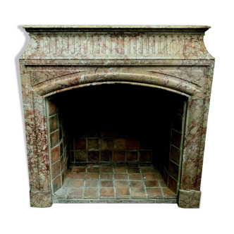 Louis XIV-style fireplace has 19th century veined pink marble hood