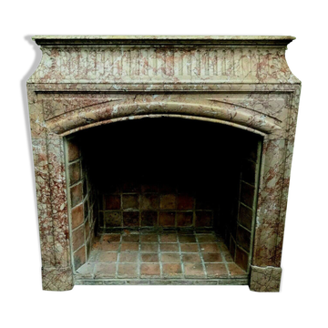 Louis XIV-style fireplace has 19th century veined pink marble hood