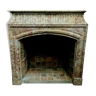 Louis XIV-style fireplace has 19th century veined pink marble hood
