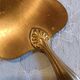 Silver cake shovel filled with silver metal