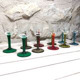 Antique and rare! Sold in a set of 12 colorful twisted stemmed glasses engraved with flowers and leaves