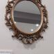 Miroir ovale baroque antique en or 58x84 cm avec cadre orné