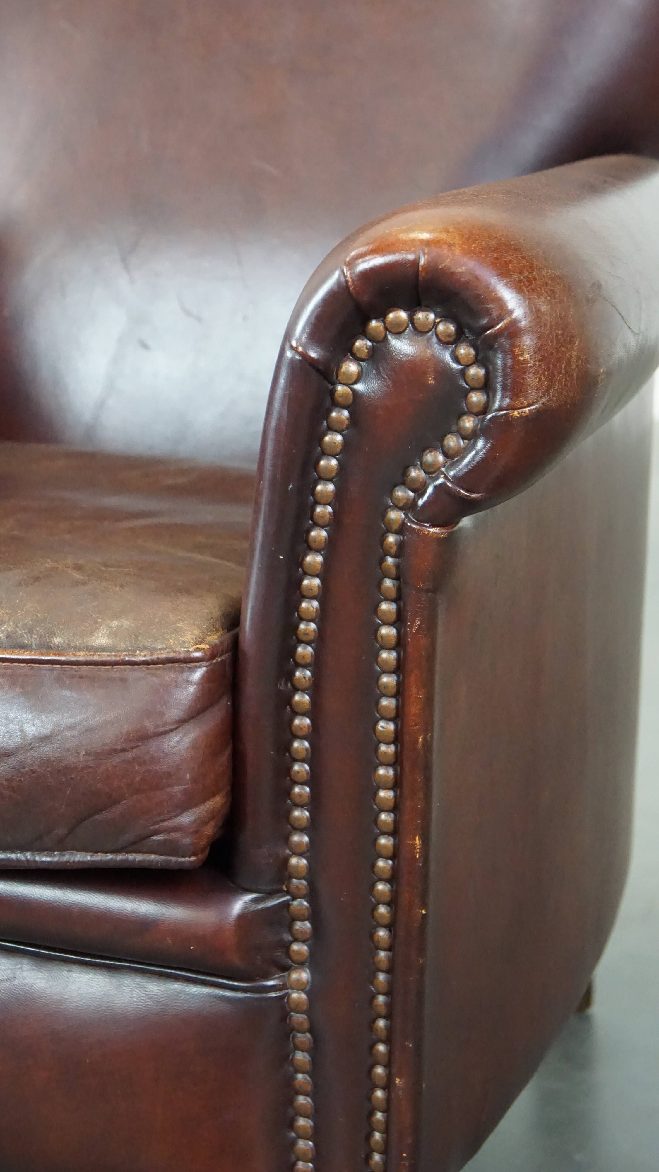 Sheep leather armchair correctly finished with decorative nails