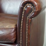 Sheep leather armchair correctly finished with decorative nails