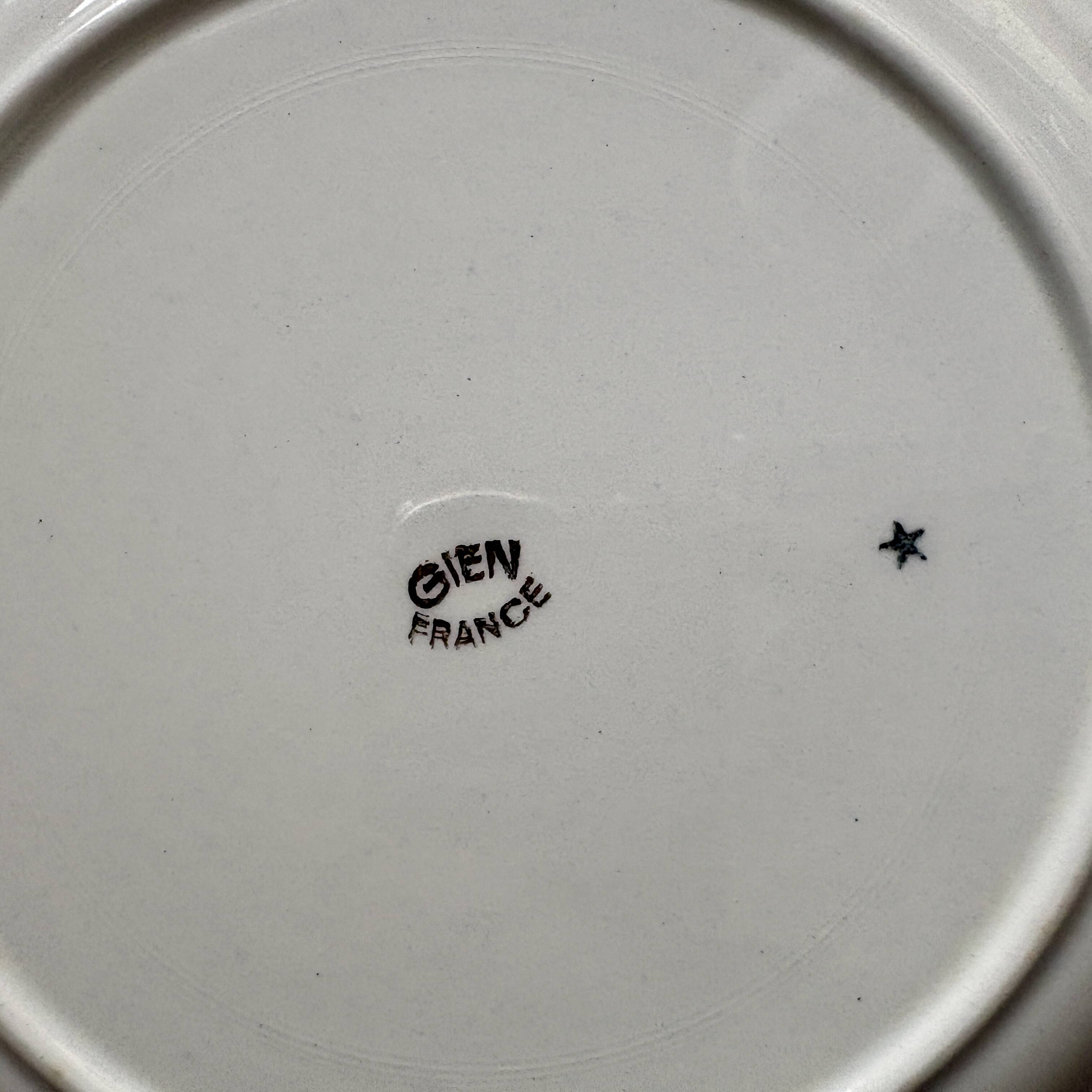 Set of 12 antique Gien red and gold dinner plates.