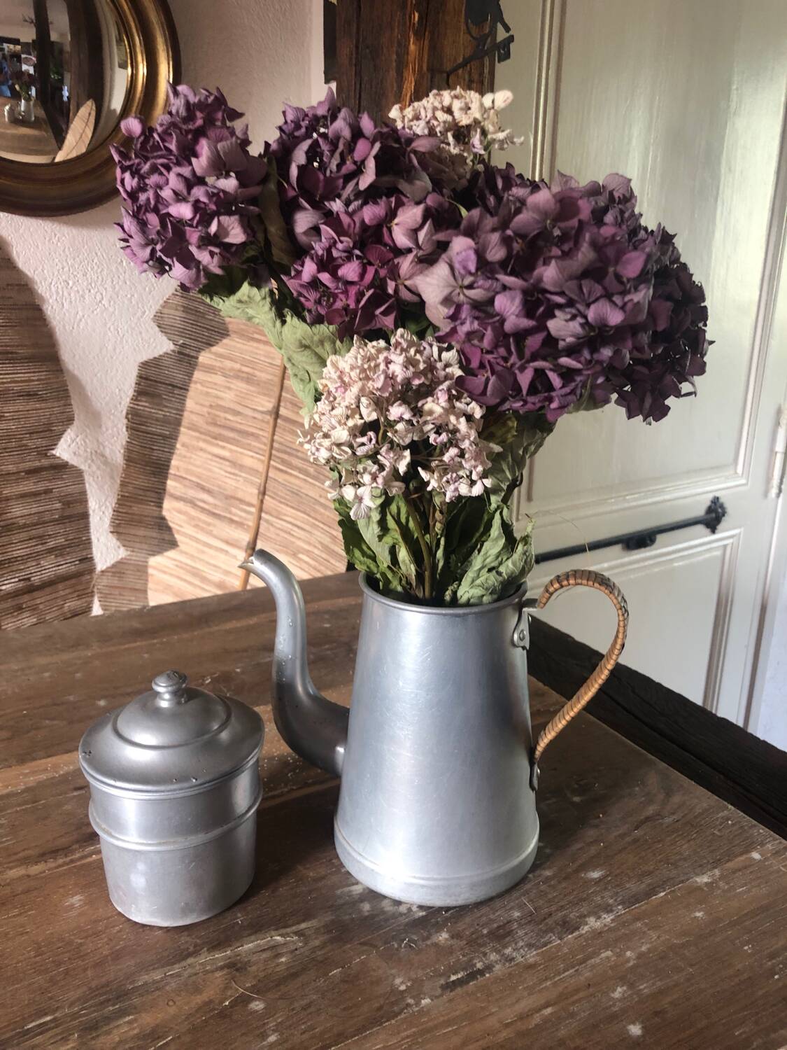 Old aluminum coffee maker, woven wicker handle