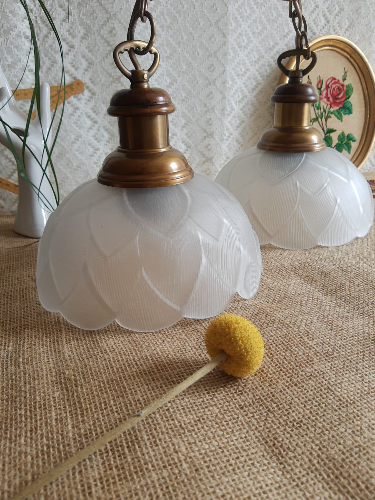 Pair of frosted glass flower pendant lights with vintage wood and brass