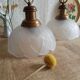 Pair of frosted glass flower pendant lights with vintage wood and brass