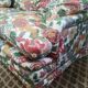 Old flowery sofa in feather